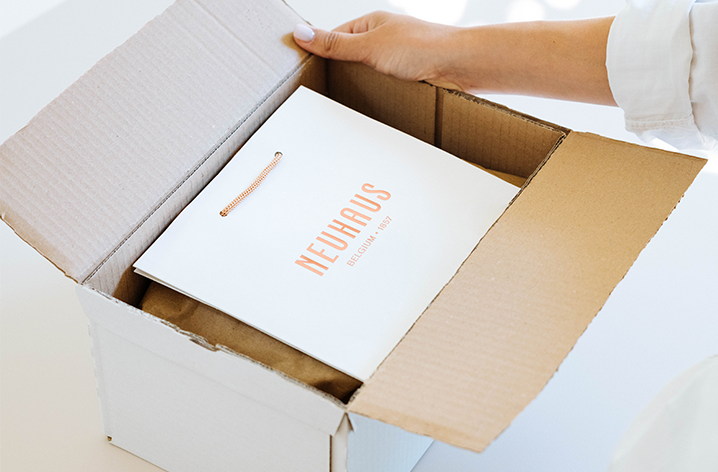 Neuhaus Chocolates Handled & Delivered With Care Neuhaus Chocolates Handled & Delivered With Care